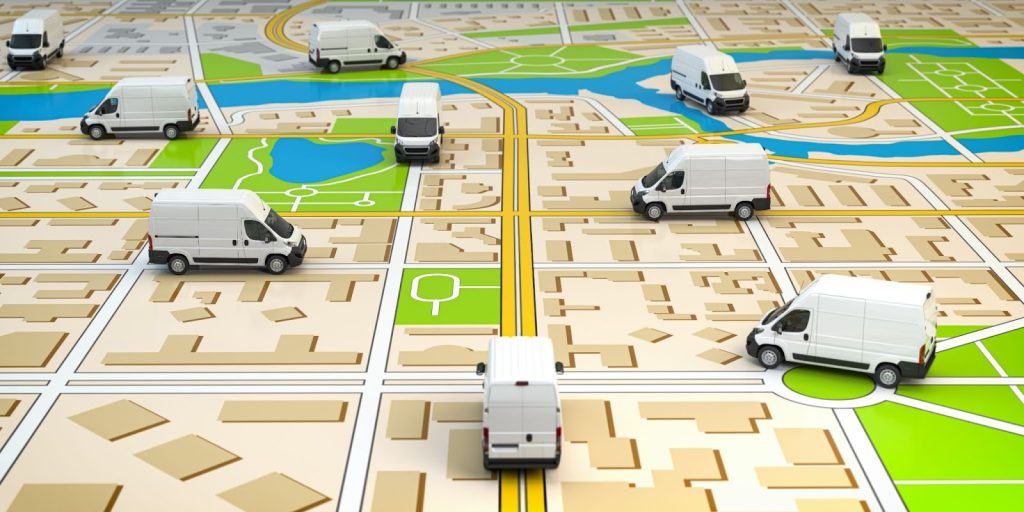 3D map of delivery vans on GPS tracker routes in a stylized city layout.