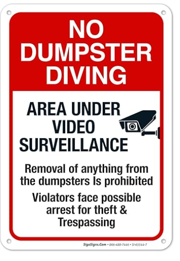 Panneau rouge mettant en garde contre la fouille des poubelles sous surveillance.