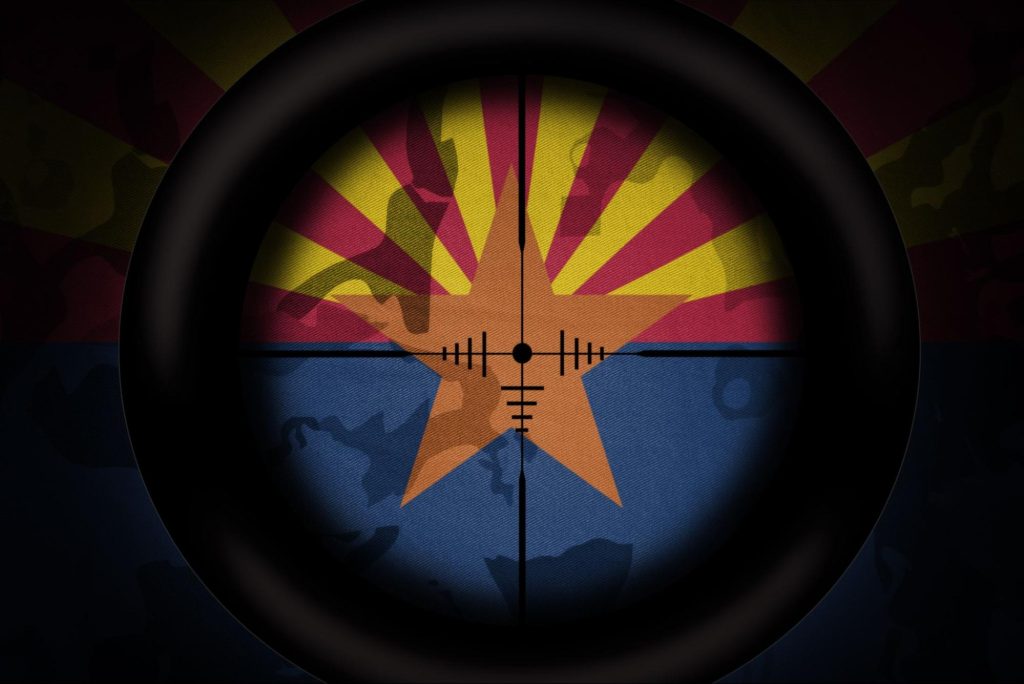 Arizona flag viewed through a sniper scope.