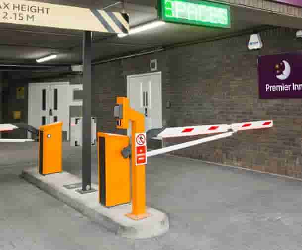 Parking garage gate with automatic access control for security.