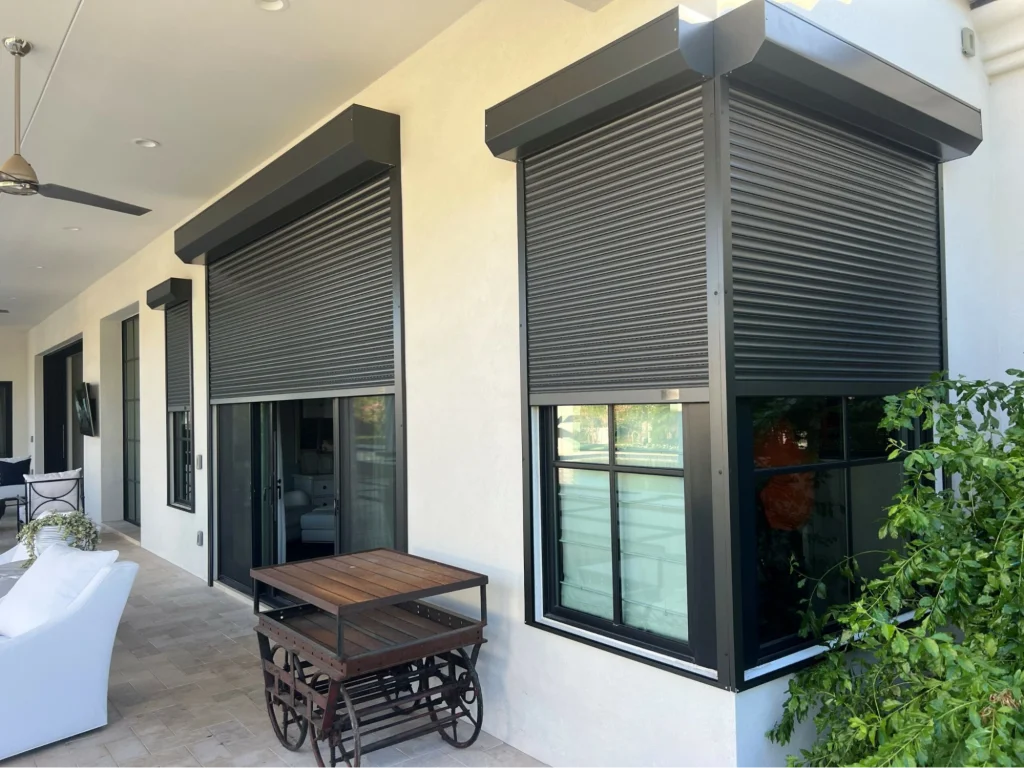 Modern home with closed window security shutters for protection.