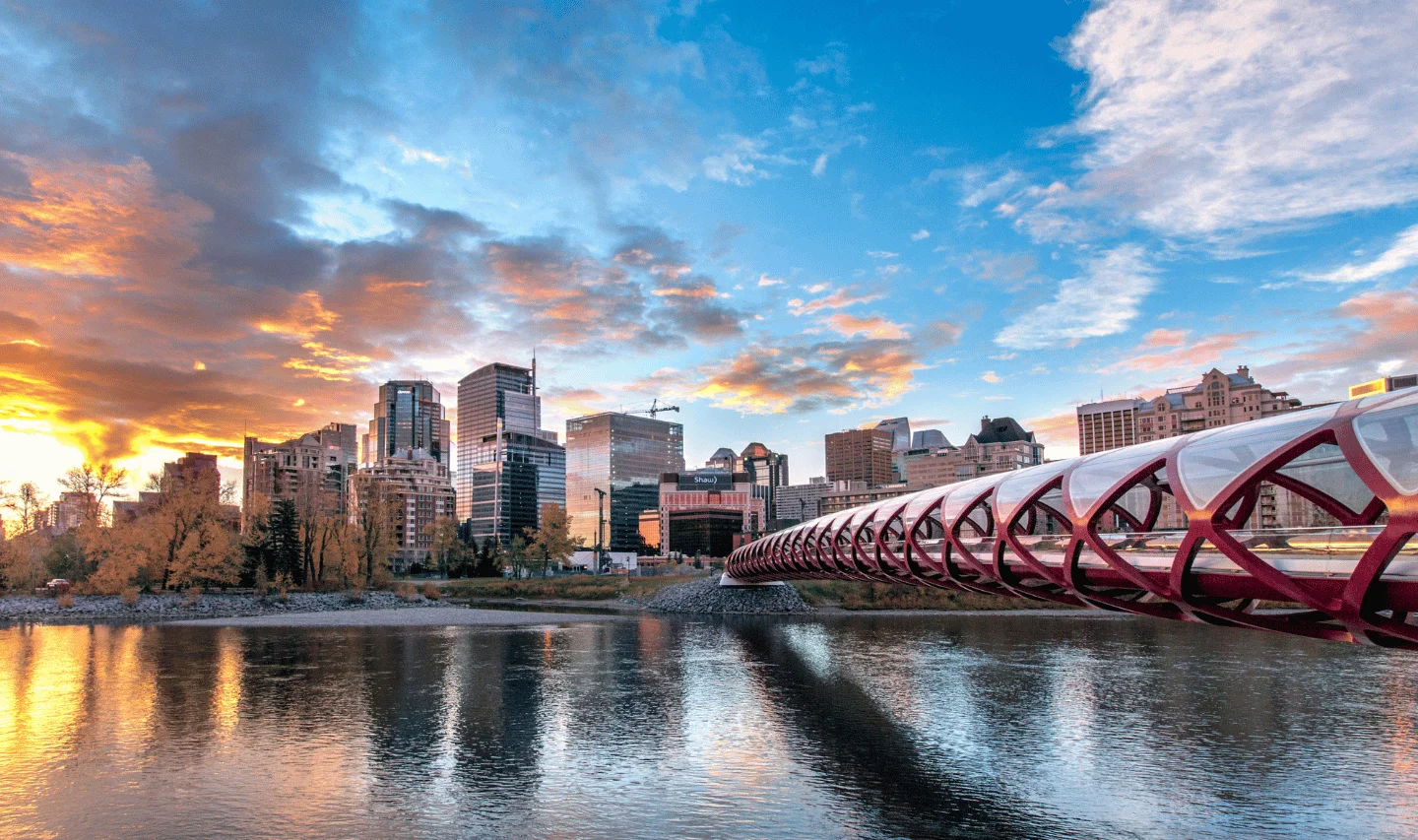 Calgary skyline with Peace Bridge at sunset