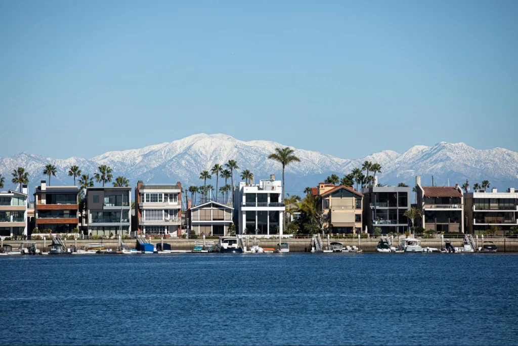 Long Beach waterfront homes with mountains in the background, depicting the city's residential area.