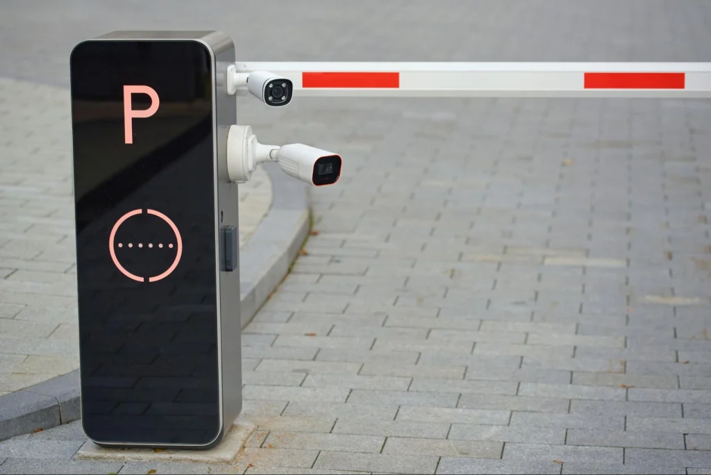 Automated parking gate with camera for license plate recognition and access control.